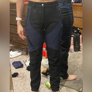 Black and blue snow pants